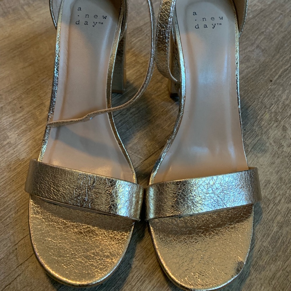 Golden high heels.
